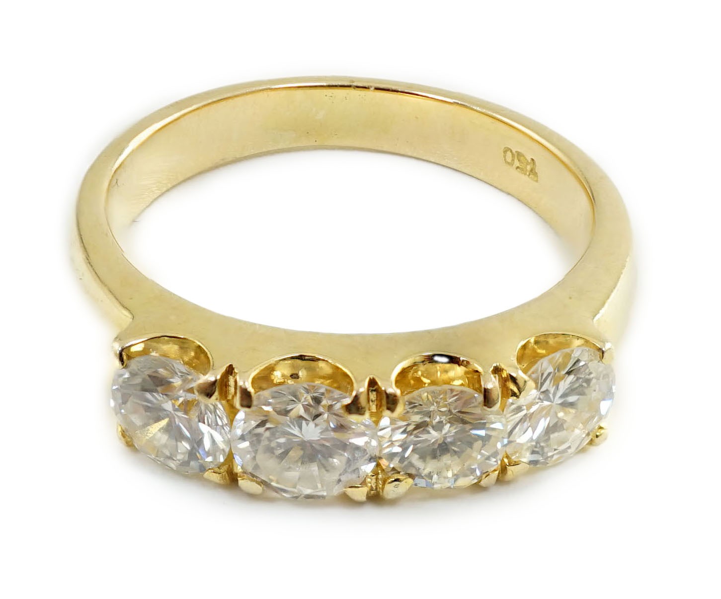 A modern 750 gold and four stone diamond set ring